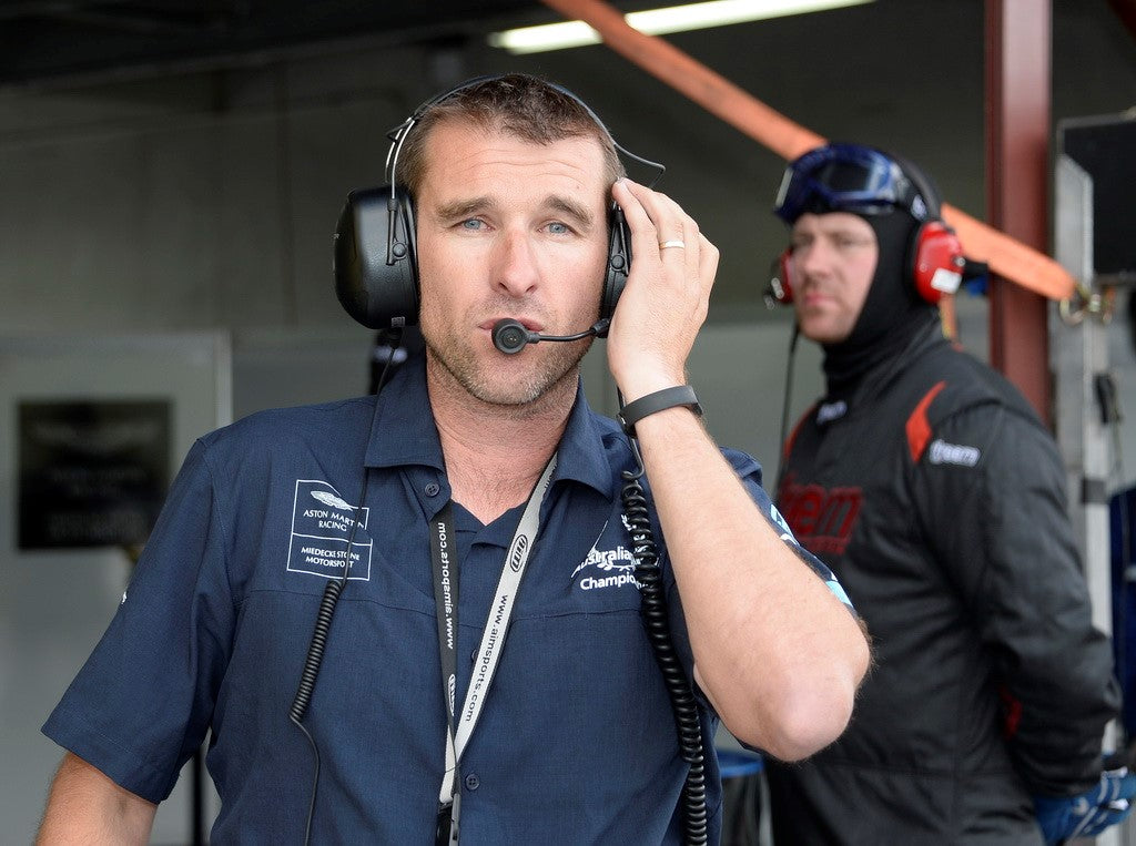 Arron Harris with a radio headset on at a race event.