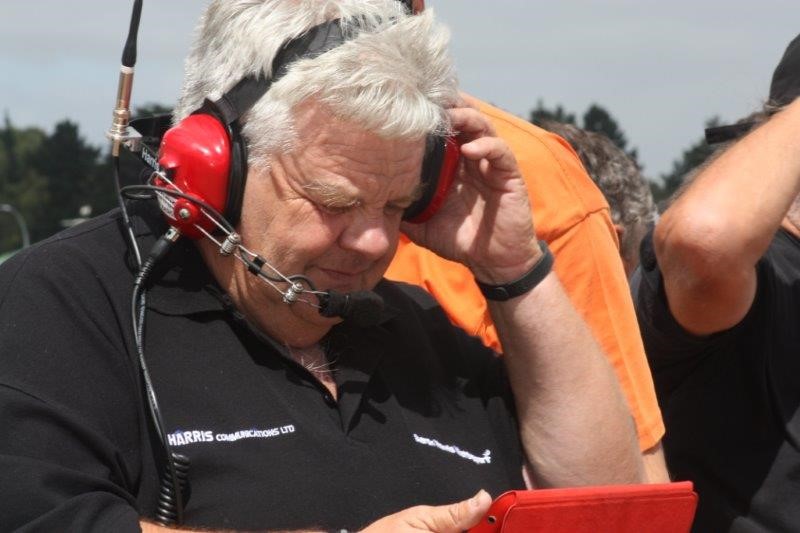 Rex Harris with a radio headset on at a race event.