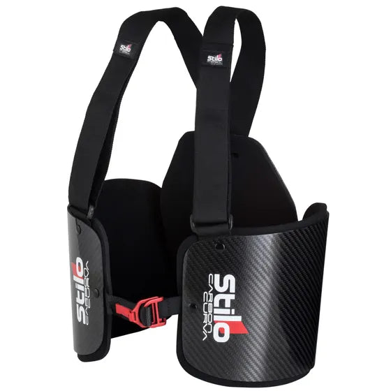 Stilo Carbon Curva kart rib protector — three-quarter view showing carbon fibre rib panels, red buckle and adjustable shoulder harness