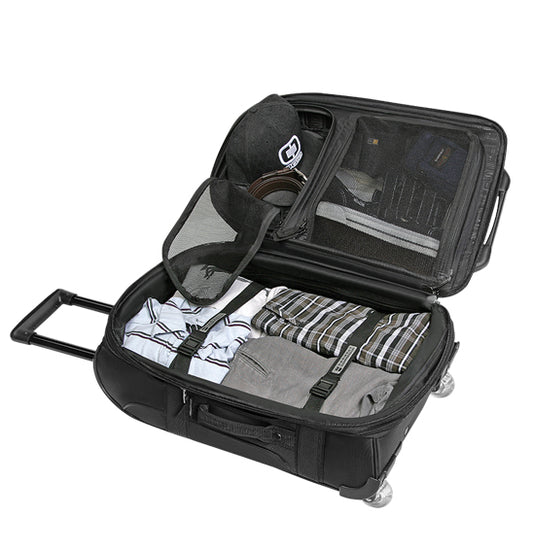 Black suitcase with clothes and a hat on a white background