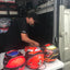 Aaron doing expert adjustments to Stilo, Schuberth, and Bell helmets for Ferrari junior development drivers. 