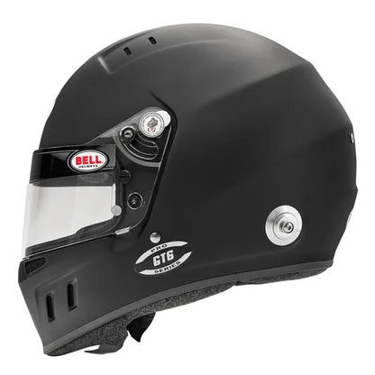 Black racing helmet with clear visor on a white background