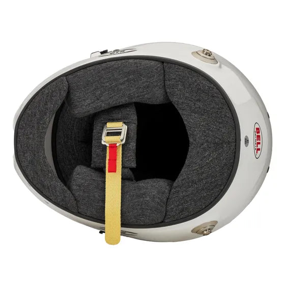 Close-up of a Bell GT6 helmet interior with a chin strap on a white background