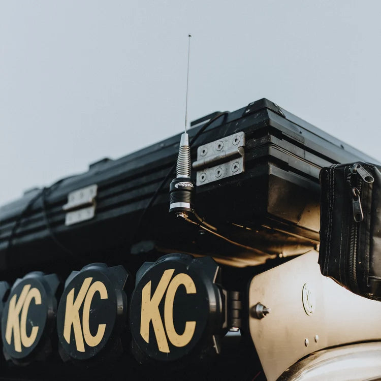 POINT5 UHF CB off-road antenna mounted beside a roof rack and auxiliary driving lights