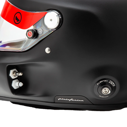Roux R1-F 2025 SA2025 helmet — close-up detail of comms plug, drink tube port, HANS anchor post and Pininfarina badge