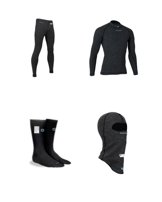 Set of black thermal underwear, long-sleeve shirt, socks, and balaclava on a white background