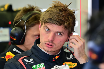 Formula 1 driver fitting a custom motorsport earpiece before a race