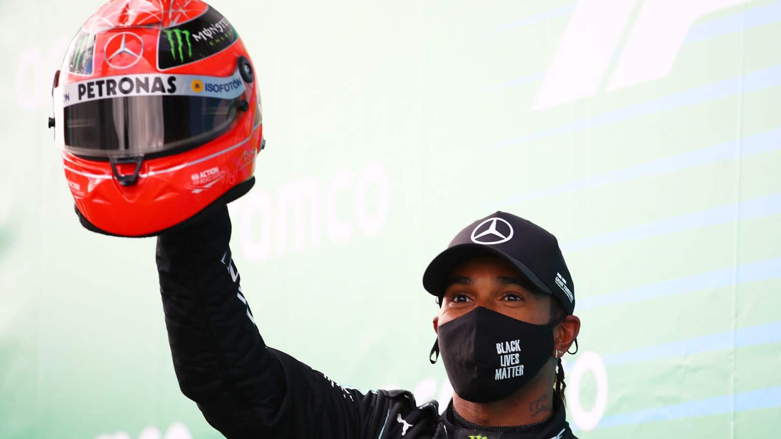 lewis Hamilton with Michael Schumacher's Schuberth helmet.