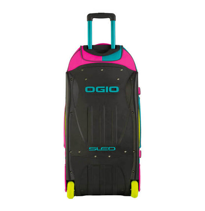 Black rolling sled with pink and teal accents and OGIO branding on a white background