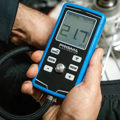 Prisma HPM5 digital tyre pressure gauge with infrared pyrometer showing pressure and temperature readings on its display