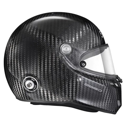 Carbon fiber helmet with a clear visor on a white background