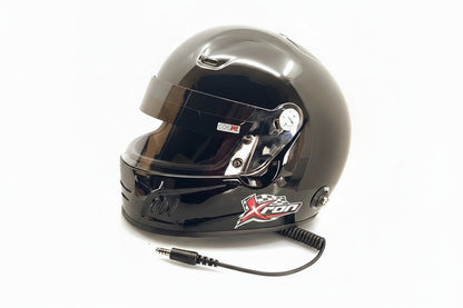 XRON SA2025 motorsport helmet gloss black with integrated communications coil cord — side view showing XRON logo and visor mechanism